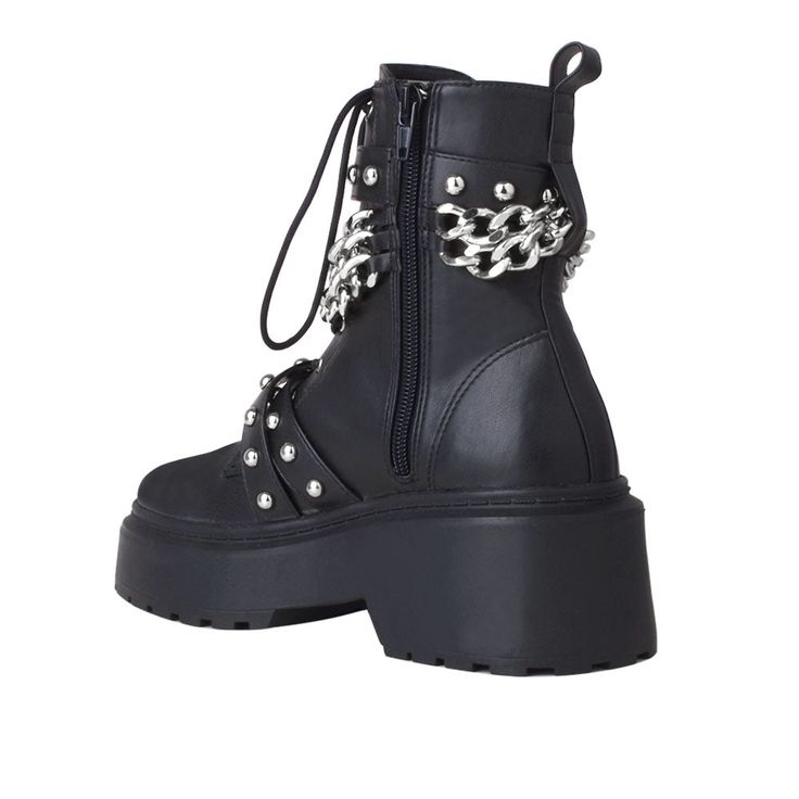 Let's bring rock n' roll vibe back with EMELIE. Bold chain with buckle punctuates this lug sole boot with stylish feel to bring out your edgy appeal. Wear them with cropped jeans, skirts, or tights. Vegan leather upper with man made sole Side zipper closure Heel measures approx. 2.5" H Platform measures approx. 1.5" H Imported Edgy Lace-up Boots With Protective Metal Feet, High Ankle Lace-up Boots With Platform, Trendy Ankle-high Wedge Boots With Reinforced Heel, Trendy Synthetic Heeled Boots With Lug Sole, Winter Leather Moto Boots, Leather Moto Boots For Winter, Trendy Ankle-high Leather Heels, High Ankle Lace-up Platform Boots Medium Width, Trendy Ankle-high Wedge Boots With Lug Sole