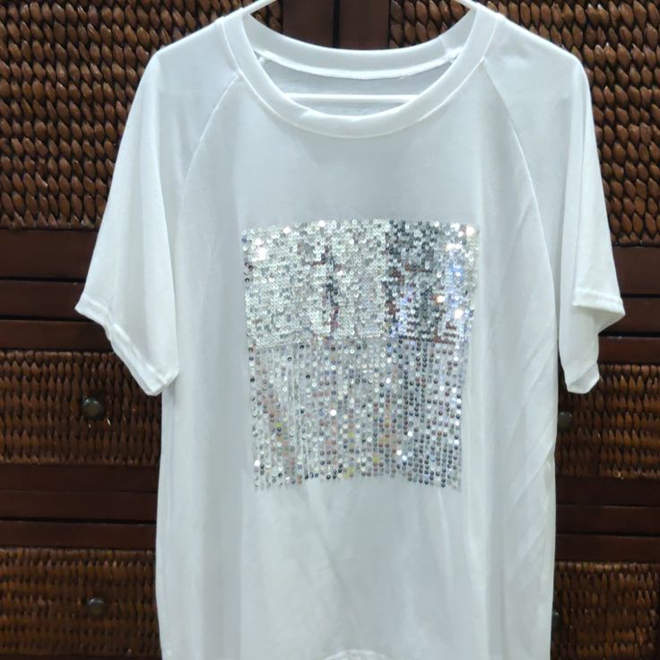 White Fancy Embellished T. Never Worn No Tags. A Bit Big For Me. Size L Silver Sequents In A Square Start Heavy And Go To Lighter Spread Out Pattern. So Cute! Casual Rhinestone T-shirt For Summer, White Crew Neck T-shirt For Party, White Rhinestone Party Tops, Casual Summer T-shirt With Rhinestones, Trendy White Tops With Rhinestones, Embellished Graphic Tee With Crew Neck, Casual White T-shirt With Rhinestones, White Embellished Crew Neck T-shirt, White Crew Neck Top For Party