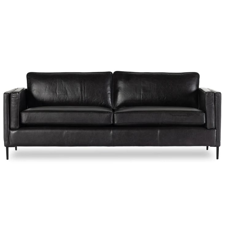 a black leather couch with metal legs and arm rests on an isolated white background,