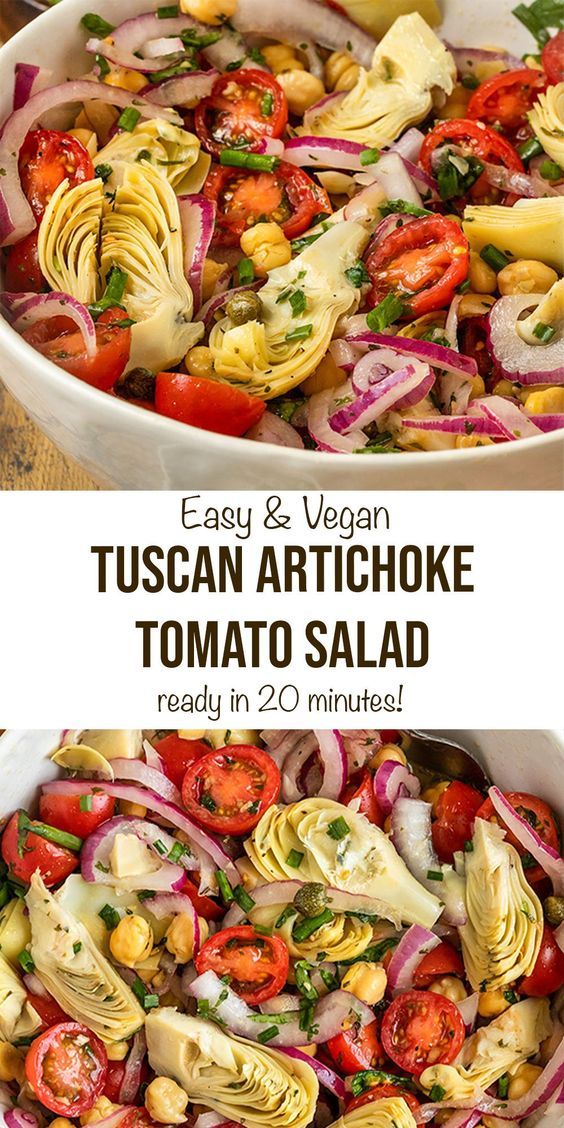 an image of a salad with tomatoes and artichokes in the middle, ready to be eaten