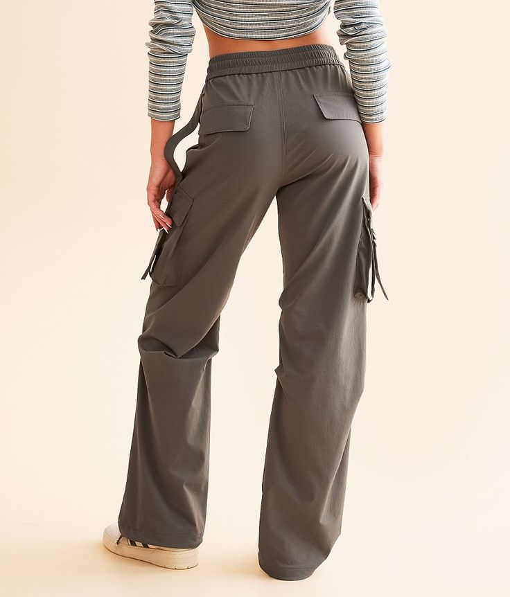 Vibrant M.I.U. Cargo Stretch Pant - Grey Medium, Women's Grey Elasticized cinch tie waistband pant Rise measures 11 1/2 30 inseam Faux flap back pockets Cinch tie bottom openings. 90% Nylon 10% Spandex. Hand wash cold water inside out. Do not bleach. Do not tumble dry. Do not iron. Apparel & Accessories > Clothing > Pants Pant For Women, Clothing Pants, Accessories Clothing, Stretch Pants, Come Back, Women's Pants, Apparel Accessories, Cold Water, Inside Out