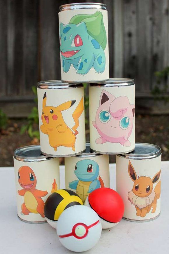 several tin cans with pokemon images on them and an egg in the middle next to it