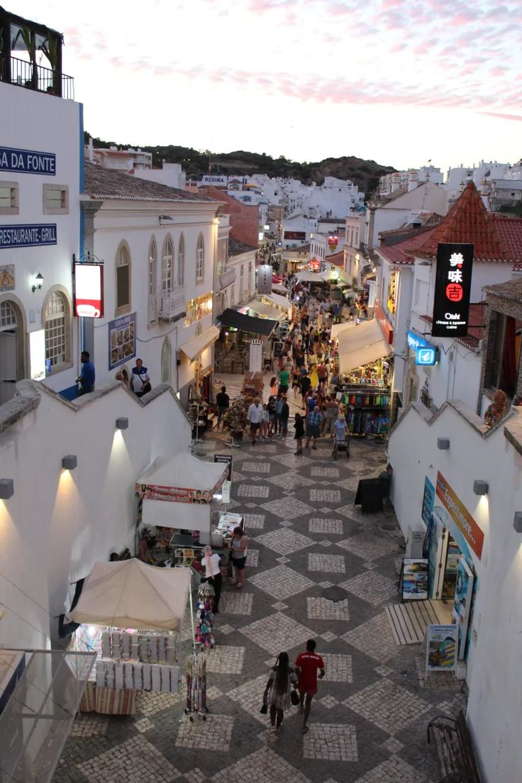 an overhead view of a city with people walking around