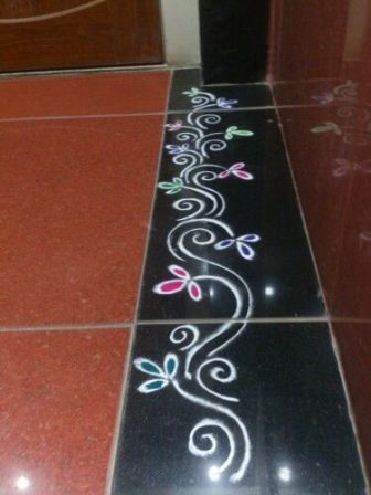 the floor is decorated with flowers and swirls in black, white, and pink