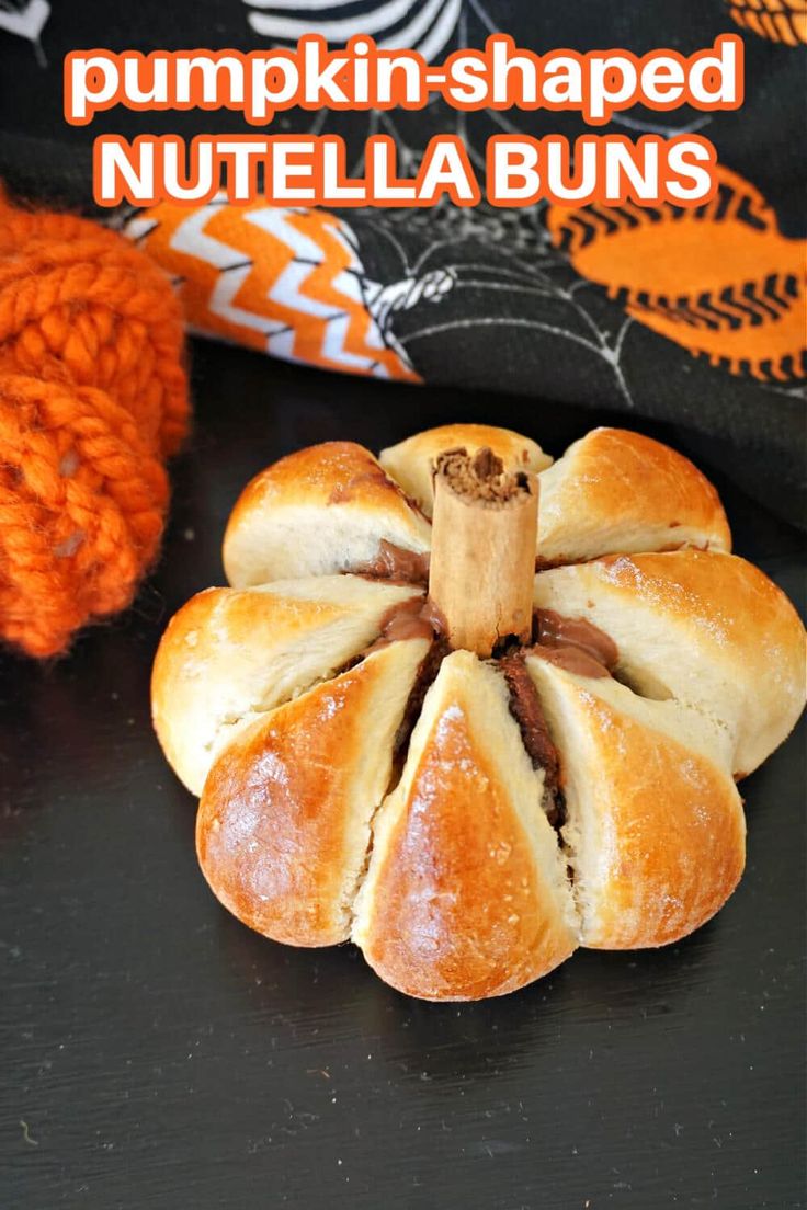 pumpkin shaped nutella buns on a black surface