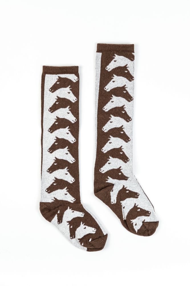 Forza Cavallo classic knee-high socks are a cozy accessory made from the finest environmentally conscious fibers: 68% recycled cotton, 17% recycled polyester, 14% nylon and 1% spandex. These horse socks provide comfort and support with an eye-catching, interwoven horse motif inspired by artist M. C. Escher. A perfect accessory to be worn alone or under boots. A great equestrian gift for any occasion, and perfect for horse lovers of any age. Fitted Brown Mid-calf Socks, Horse Socks, M C Escher, Horse Motif, Cozy Accessories, Equestrian Gifts, Women's Socks, Horse Lovers, Environmentally Conscious