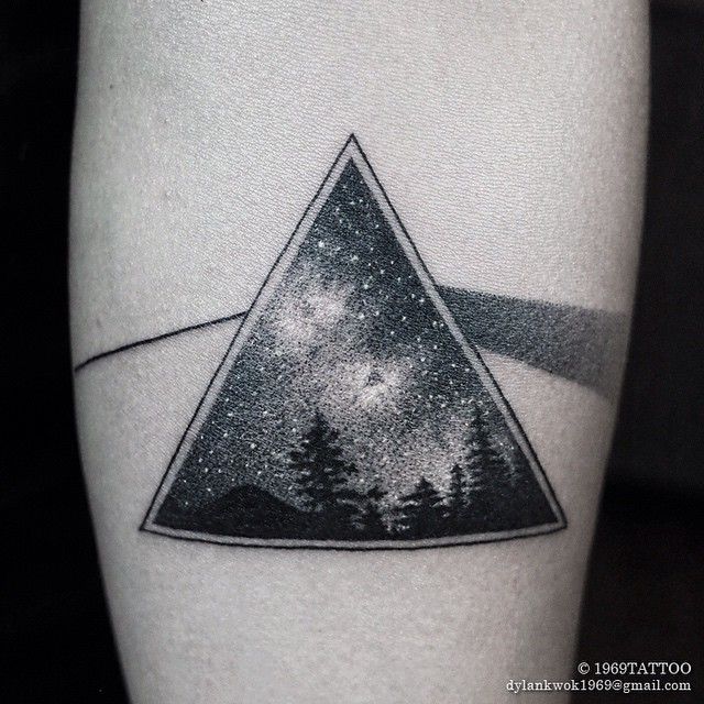 a triangle with trees on it and stars in the night sky behind it is an image of