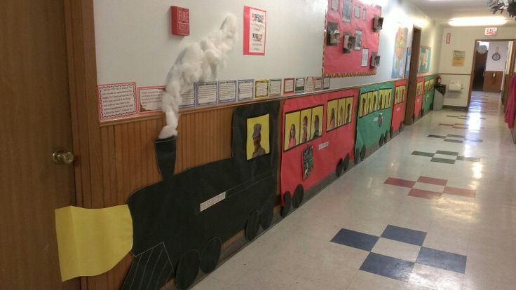 the hallway is decorated with many different colored train tracks and paper cutouts on the wall