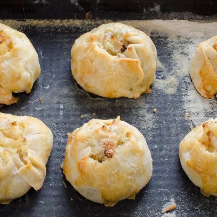 eight freshly baked pastries on a baking sheet