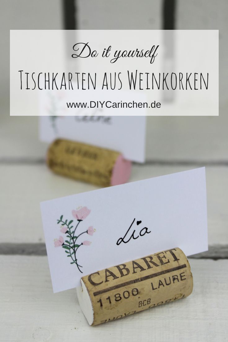 two wine corks are sitting next to each other on a table with the words do it yourself written in german