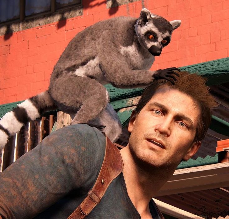 a man is holding a stuffed animal on his shoulders