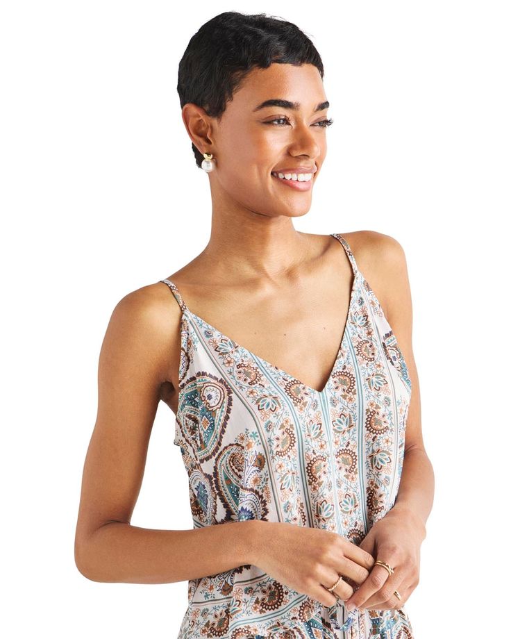 Get into a summer state-of-mind in our Venice Tank-- a loose-fitting flowy top with a silky soft feel and a Pacific-inspired lagoon paisley print. It's deep V-neck lets you soak up sunshine (and pack on some dainty layering necklaces) while the adjustable straps offer a custom fit. Pair it with the matching Venice Pant for the ultimate summertime uniform. Pacific-inspired lagoon paisley print Deep V-neck Adjustable spaghetti straps Easy, flowy fit Patterned V-neck Rayon Tops, Vacation Viscose V-neck Tops, Vacation V-neck Viscose Tops, Printed Viscose V-neck Top, Flowy Viscose Top For Day Out, Flowy Casual Tops With Boho Print, Flowy Boho Print Casual Tops, Casual Flowy Tops With Boho Print, Summer Flowy Viscose Tops