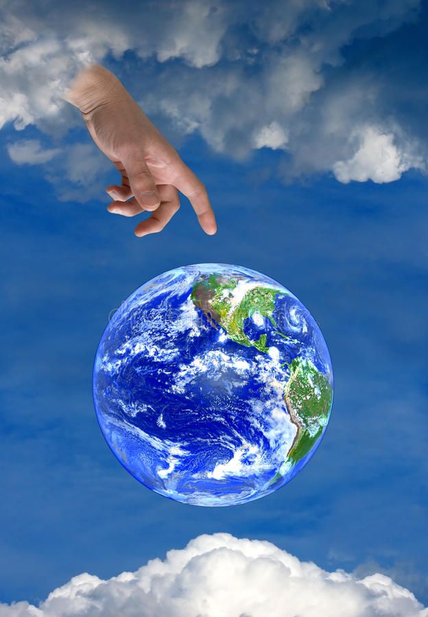 a hand reaching for the earth in the sky with clouds and blue sky behind it