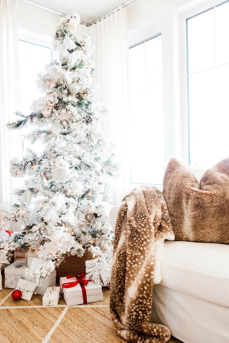 a white christmas tree in a living room