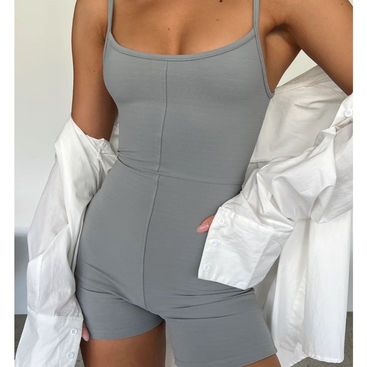 Gray Romper Never Used Still Have Tags On Size Small Gray Bodysuit For Spring Loungewear, Spring Gray Bodysuit For Loungewear, Gray Spring Bodysuit For Loungewear, Spring Gray Loungewear Bodysuit, Fitted Solid Color Jumpsuits And Rompers For Day Out, Gray Jumpsuits And Rompers For Spring, Gray Solid Color Jumpsuit For Spring, Spring Gray Solid Color Jumpsuit, Gray Sleeveless Bodysuit For Spring