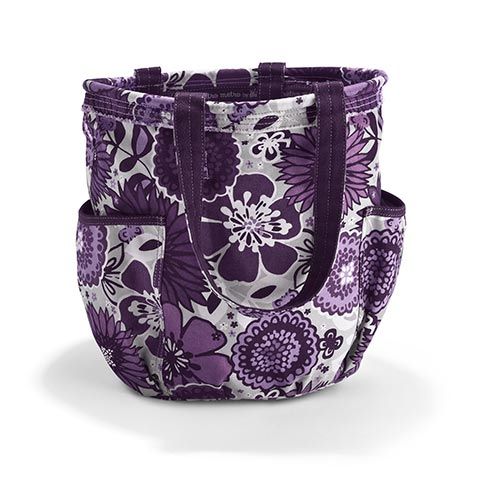 a purple and white flowered tote bag on a white background with the handles open