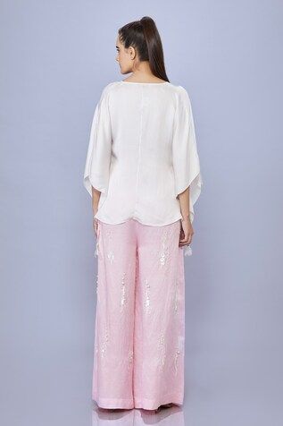 Light pink trouser featuring sequin and pearl hand embroidery with pockets. - Aza Fashions Embellished Spring Trousers, Embellished Spring Bottoms, Embellished Pink Bottoms For Spring, Pink Embellished Bottoms For Spring, Elegant Embellished Pink Bottoms, Elegant Pink Embellished Bottoms, Pink Sequined Pants For Summer, Summer Pink Sequined Pants, Sequin Bottoms For Spring Wedding