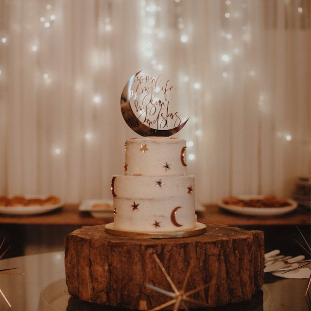 a wedding cake with the moon and stars on it