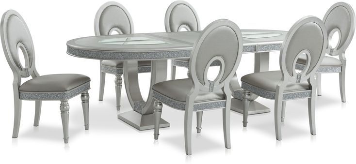 a dining room table and chairs with grey upholstered backrests on an isolated white background