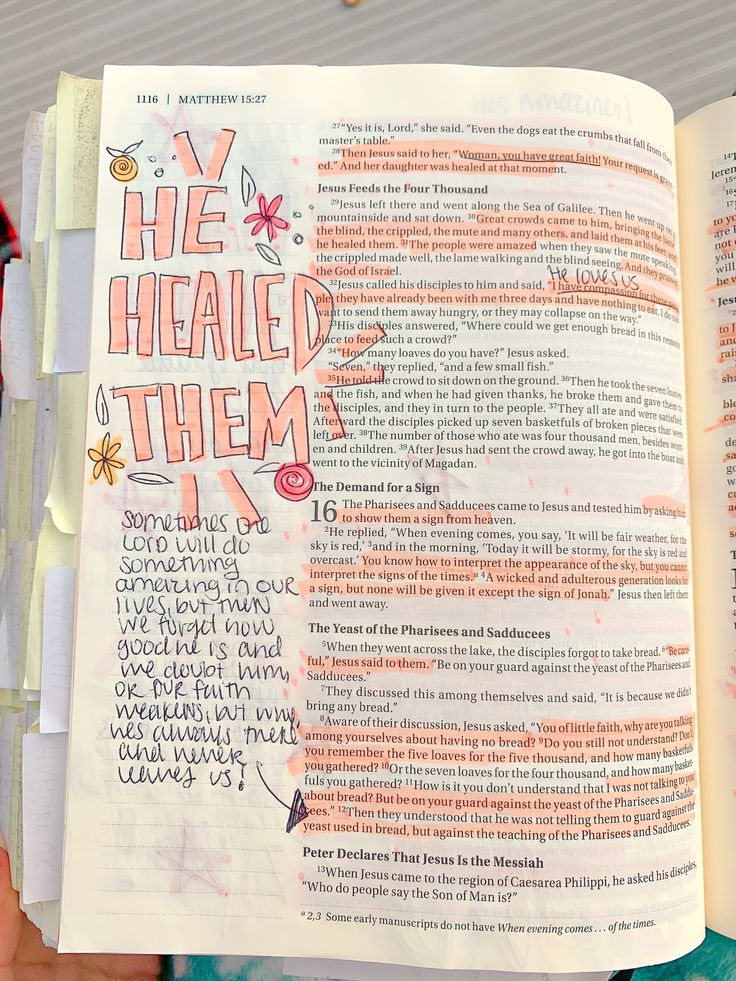 an open bible with the words he heald them written on it in orange and pink