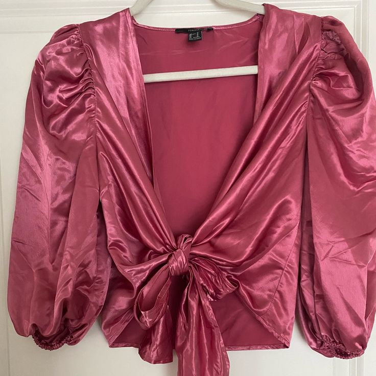 Plunging V-Neck, Satin, Front Tie Blouse. Bnwt! Features 3/4 Length Puff Sleeves. Super Cute Just Didn’t Care For The Color On Me. Glamorous V-neck Tops For Date Night, Glamorous Pink V-neck Blouse, V-neck Padded Blouse For Brunch, Glamorous V-neck Crop Top For Spring, Glamorous V-neck Crop Top For Summer, Glamorous V-neck Summer Crop Top, Trendy V-neck Blouse For Party, Glamorous Puff Sleeve Tops For Spring, Summer V-neck Blouse For Going Out