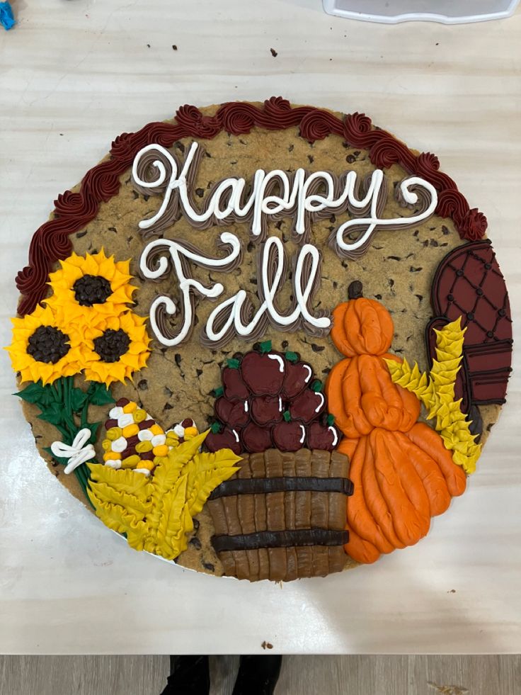 a birthday cake that says happy fall with sunflowers and pumpkins on it