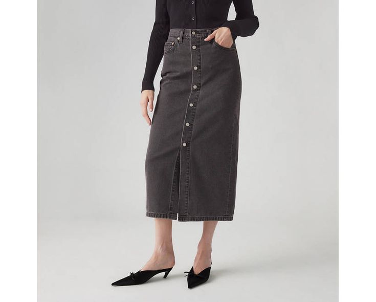 It doesn't get more timeless than our Button Midi Skirt. We gave it a mid rise, a button-up front and finished it off with the perfect midi length. A timeless midi skirt Cut with a midi silhouette Finished with a button-up front Crafted with non-stretch denim Workwear Bottoms With Button Closure And Midi Length, Fall Workwear Skirt With Buttoned Pockets, High Rise Skirt For Workwear, Fall Season, High Rise Skirt For Fall Workwear, Fall Pencil Skirt With Button Closure, Fitted Skirt With Snap Buttons For Fall, Button-up Work Skirt With Buttoned Pockets, Classic Pencil Skirt With Button Closure, Chic Midi-length Bottoms With Buttons