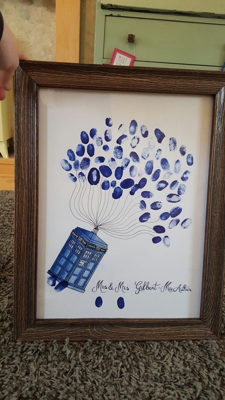 a drawing of a blue tardish in a wooden frame