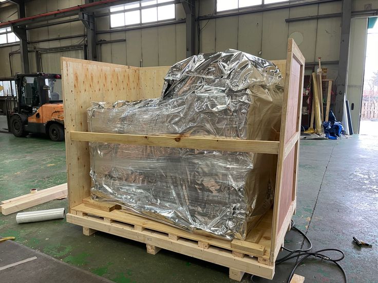 the pallet is covered with aluminum foil and ready to be shipped into the warehouse