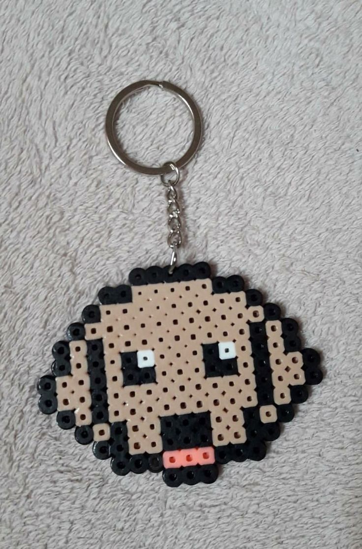 a keychain made out of legos is shown with an image of the character