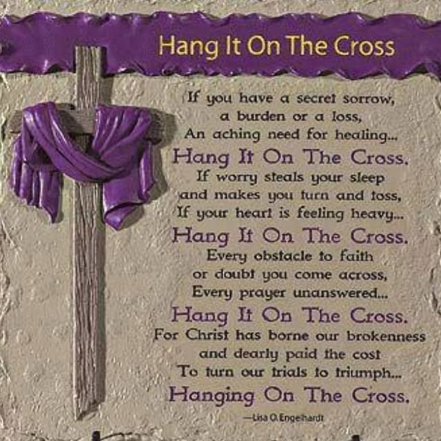 a cross with purple ribbon hanging from it's side and the words hang on the cross