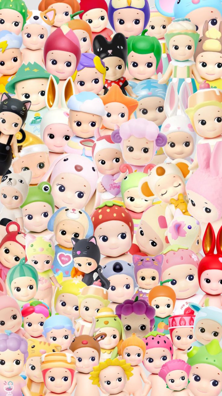 an image of many different colored dolls in the same group, all with faces on them