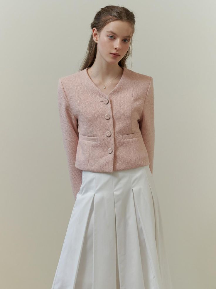 This piece of clothing is a textured jacket featuring a notched lapel and a three-button closure. This piece of clothing is a textured jacket featuring a notched lapel and a three-button closure. It is tailored with a structured fit and includes two patch pockets on the front. The sleeves are full-length, and the overall design exudes a formal yet contemporary aesthetic.- The jacket presents a sophisticated appearance with its notched lapels and button details.- Patch pockets add both function and a casual touch to the otherwise formal item.- Its textured fabric contributes to a rich, tactile experience and visual depth. Classic Single Breasted V-neck Outerwear, Elegant Single Breasted Cardigan With Lapel Collar, Semi-formal V-neck Outerwear For Winter, Semi-formal V-neck Winter Outerwear, Single Breasted V-neck Blazer For Business Casual, Elegant Single Breasted Cardigan For Office, Elegant Single-breasted Cardigan For Office, Chic Formal Single Breasted Cardigan, Tailored V-neck Blazer With Buttons