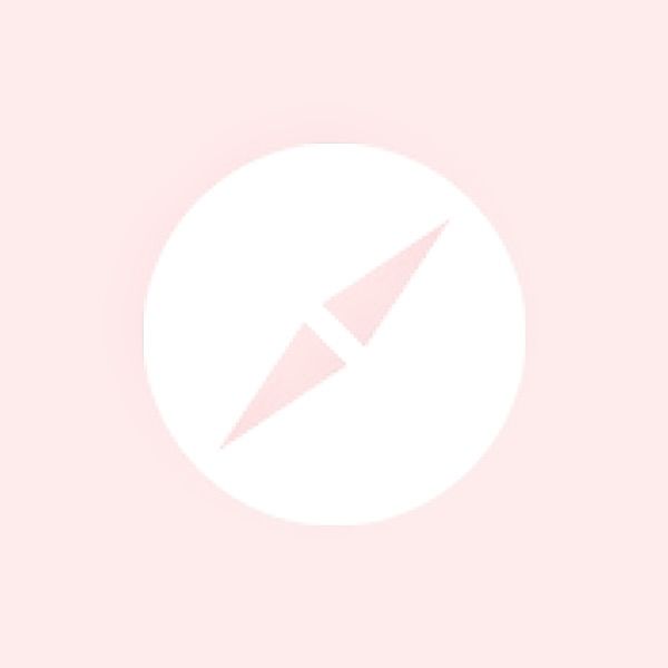 a white circle with a pink arrow in the center on a light pink background,