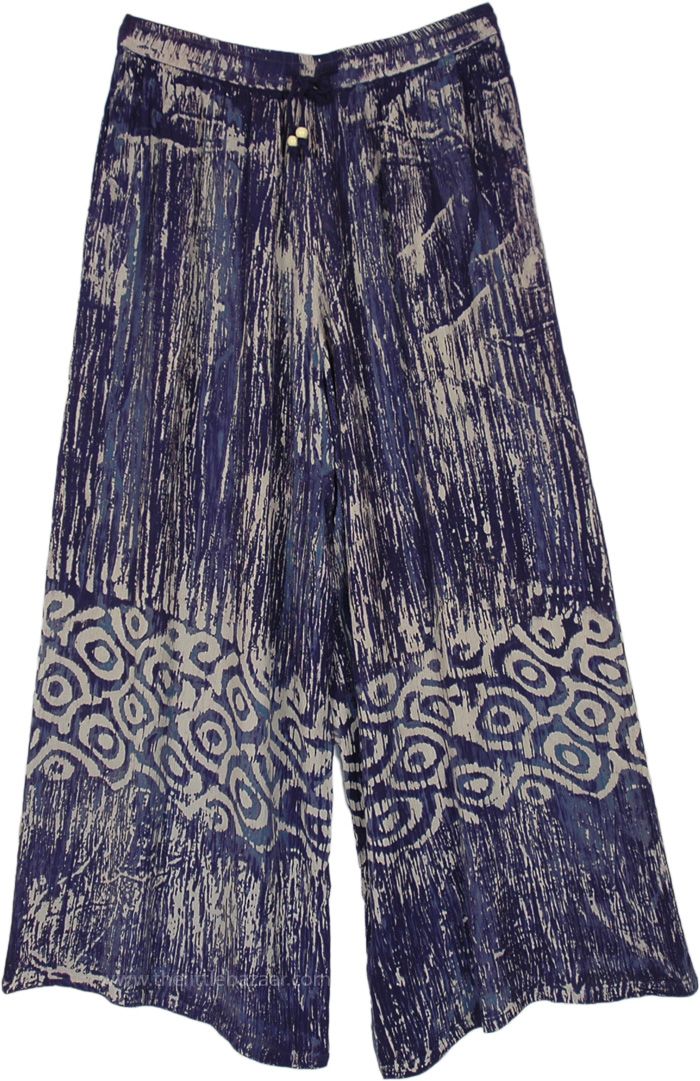 A comfortable pair of flowy wide-leg pants with bohemian style print.  The prints are inspired by a ink on a canvas and tribal patterns near the bottom create a charming look. #tlb #SplitSkirtsPants #vacationclothing #Printed #bohemianfashion #WideLegPants #BeachPants #CasualPants #HippiePants Sofia Reyes, Dead Beat, Bridesmaids Outfits, Navy Clothing, Flowy Wide Leg Pants, Png Clothes, Tropical Oasis, Navy Outfit, Hippie Pants