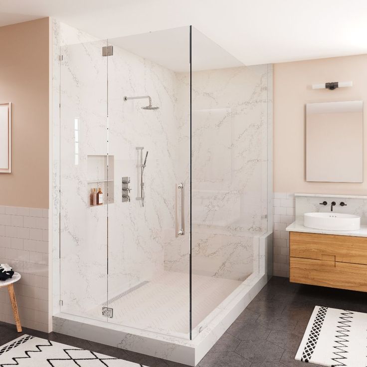 a bathroom with a walk in shower next to a sink