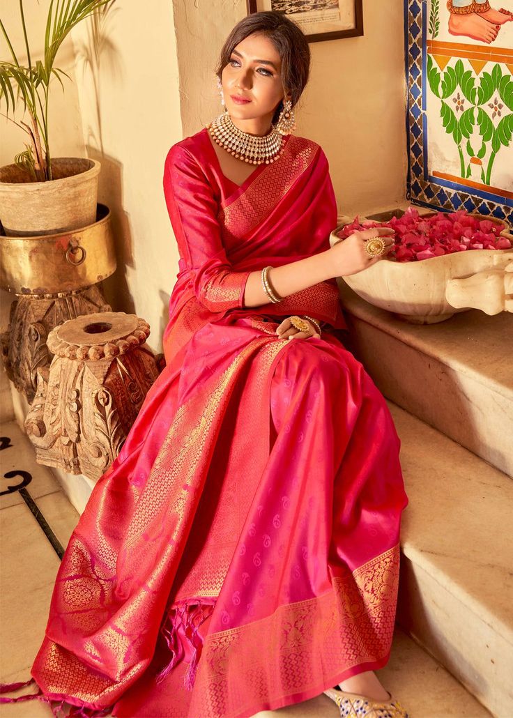 ROYAL PRINCESS PINK WOVEN KANJIVARAM SILK 106  Desc:      Intricate timeless design on this grand saree is perfect for a grand occasion this Kanjivaram saree will easily attract eyes. With exquisite design spread across the length of the saree it is perfect for any occasion. This saree has a white tone with a slight blend of gold colour. It has been the best seller till date! The saree is as soft as butter. Saree length : 5.5 meterBlouse piece :  0.8 meterFabric : Blended silk and Zari. With Exp Long Sleeve Blouse Piece With Zari Weaving For Wedding, Wedding Long Sleeve Blouse With Zari Weaving, Festive Long Sleeve Saree With Pallu, Transitional Season Pink Saree In Traditional Drape, Fitted Pink Traditional Wear With Zari Weaving, Transitional Pink Saree With Zari Weaving, Semi-stitched Pink Blouse Piece For Traditional Ceremonies, Red Saree With Self Design And Long Sleeves, Pink Traditional Wear With Pallu For Transitional Season