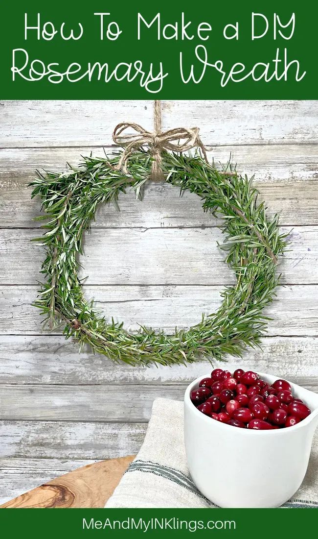 a white bowl filled with cranberries on top of a table next to a wreath