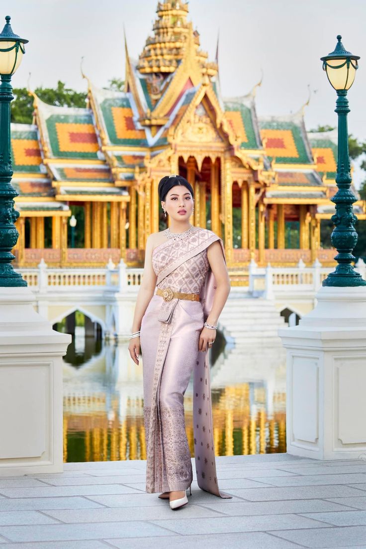 a woman standing in front of a large building