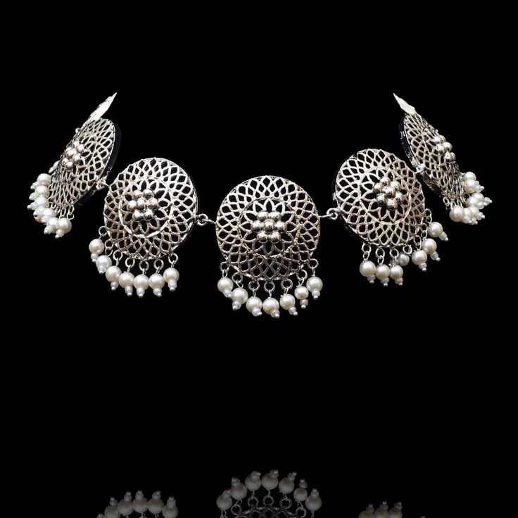 Be a trendsetter and ignite your inner fashionista with tribal accessories! Adorn our Rayen Set crafted with intricate filigree and pearl moti hanging. The set includes a necklace and a pair of stunning earrings with saharay. Approximate earrings length is 3". Designed over brass with silver oxidized finish. Made by order. Kindly allow 5-7 weeks for the delivery of this item. For custom or urgent requests, please contact support@alacouture.com. *Please Note: We use faux stones and beads in all o Unique Gift Cards, Faux Stone, Stunning Earrings, Necklace Earring Set, Necklace Earrings, Earrings Set, Trend Setter, Picture Perfect, Earring Set