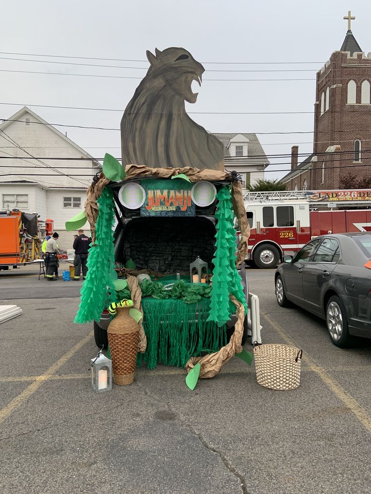 a car decorated with green decorations in a parking lot