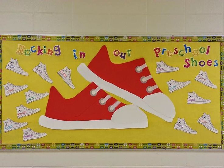 a bulletin board with red and white shoes in front of yellow background that says rocking in our preschool shoes