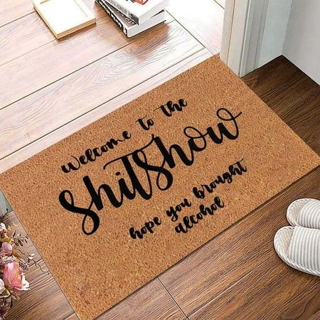 a door mat with the words welcome to the shitsho after you've arrived