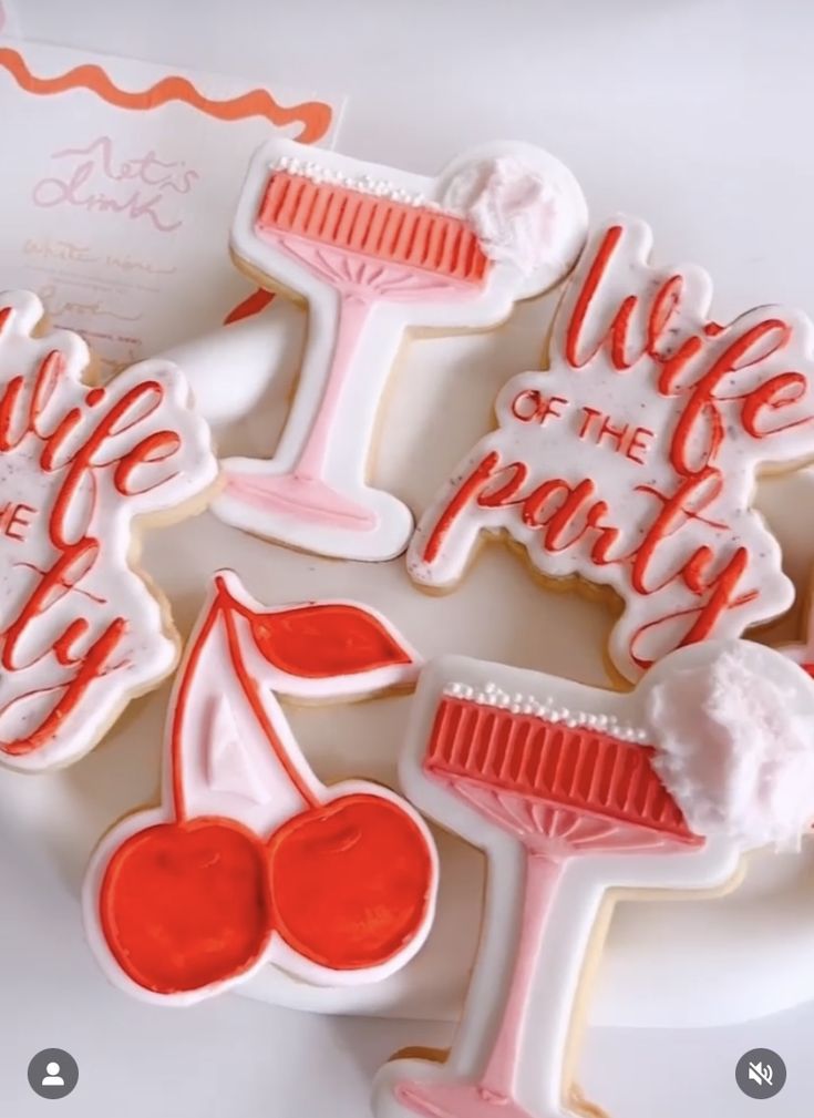 decorated cookies with the words life of the party written in red and white frosting