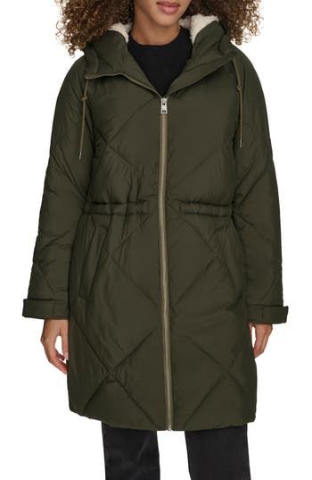 Staying warm will become effortless in this diamond-quilted parka that's water resistant and lined with cozy fleece at the hood. A drawcord-toggle waist lets you adjust the silhouette if you prefer a more snug fit. Front zip closure Drawstring hood Front welt pockets Adjustable snap cuffs Drawcord-toggle waist Water resistant Lined, with 100% polyester fill 100% polyester Machine wash, tumble dry Imported Long Parka Jacket, Womens Sherpa, Quilted Parka, Puffer Parka, Coat With Hood, Long Parka, Levis Jacket, Quilted Puffer Jacket, Hooded Parka