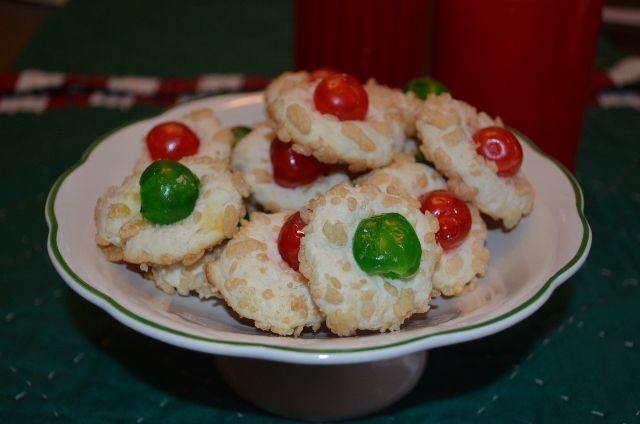 a white plate topped with cookies covered in gummy bears