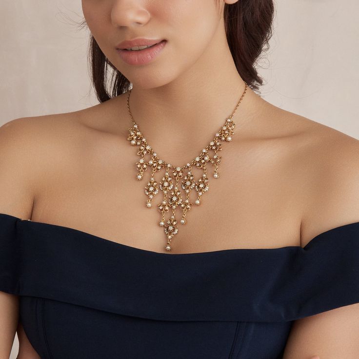 Our Ambrosia necklace is perfect for brides looking to stand out on their big day. Handcrafted with genuine clear crystal stones on 24K gold-plated metal, the statement design is sure to turn heads with any ensemble. The necklace features a simple lobster claw closure for easy wear. All jewelry is made to order in our New York City design studio. Please allow 7-14 business days for production from the order date. Measurements: 16" L with 2" extension; 3 1/4" pendant drop Crystal Stones, Bride Look, City Design, Gold Crystal, Bridal Necklace, Easy Wear, Clear Crystal, Lobster Claw, Stones And Crystals