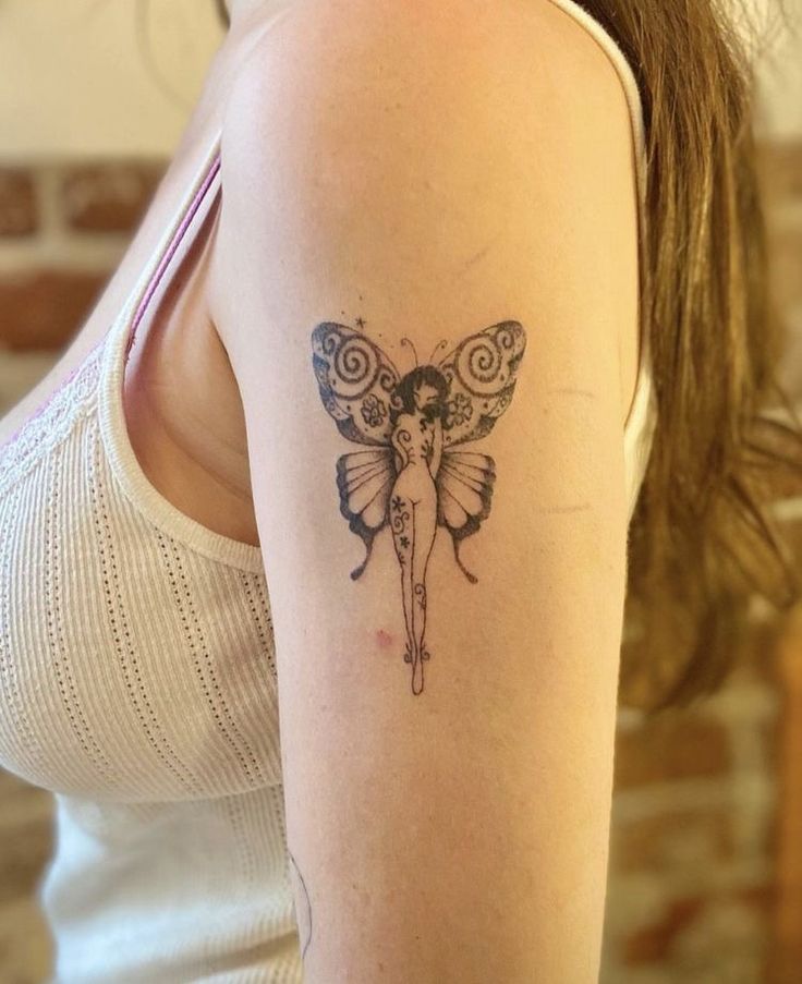 a woman with a butterfly tattoo on her arm