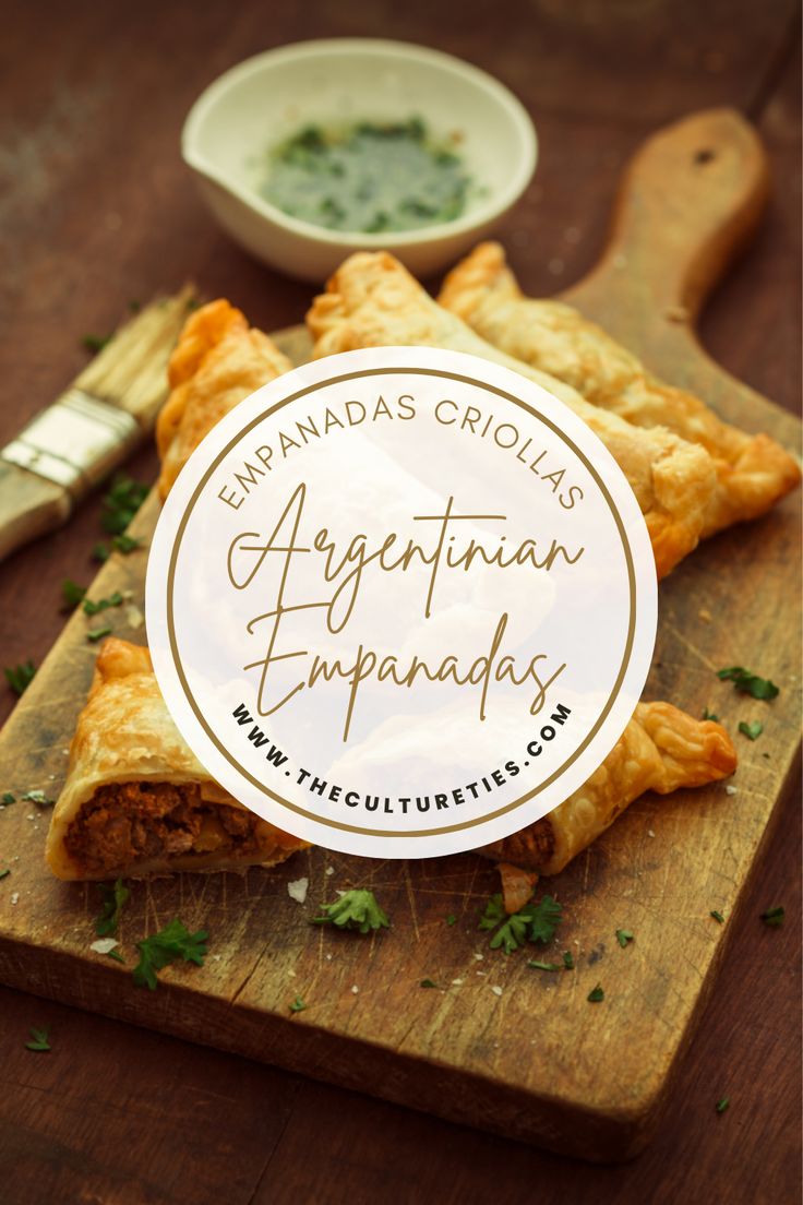 an appetizer empanada on a wooden cutting board