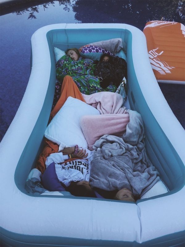 an inflatable pool is filled with clothes